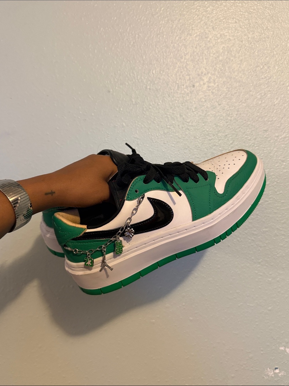 Nike Elevated 1s. Women's Green and White Low-Top Sneakers with Black Swoosh
